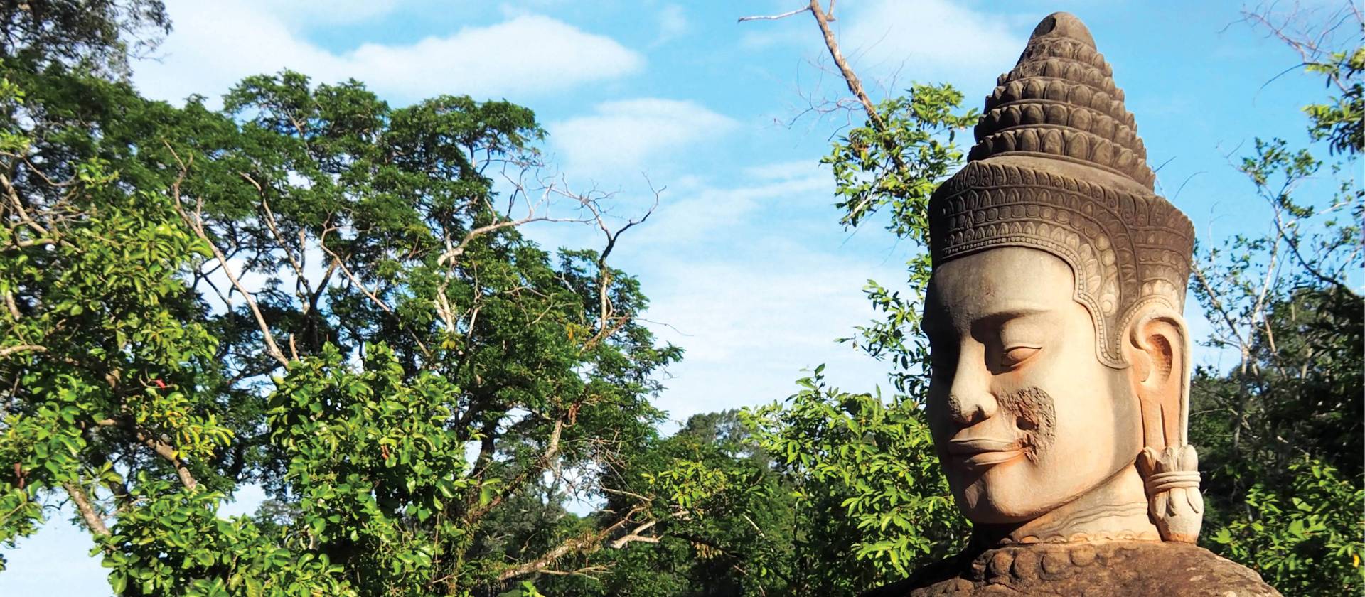 Khmer statue leading into Angkor Thom | Scott Pinnegar