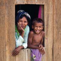 Relaxed Mother and Son onlooking the streets of Cambodia |  <i>Peter Walton</i>