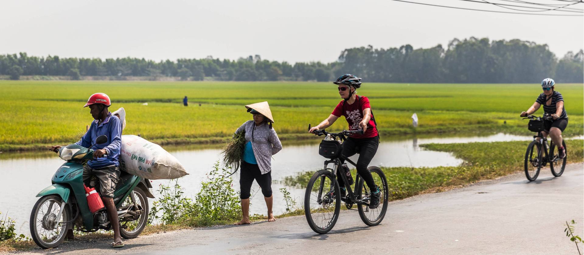 Passing locals near Chau Doc in the Mekong Delta | Lachlan Gardiner