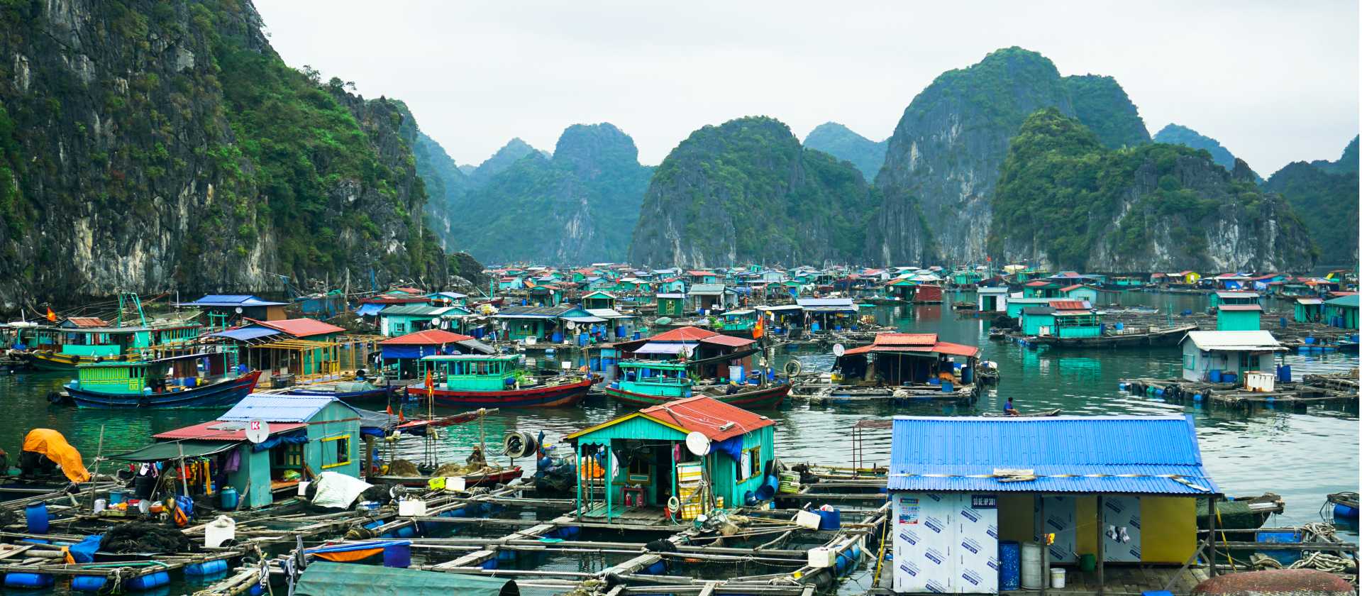 Kayak through floating fishing villages in Lan Ha Bay
