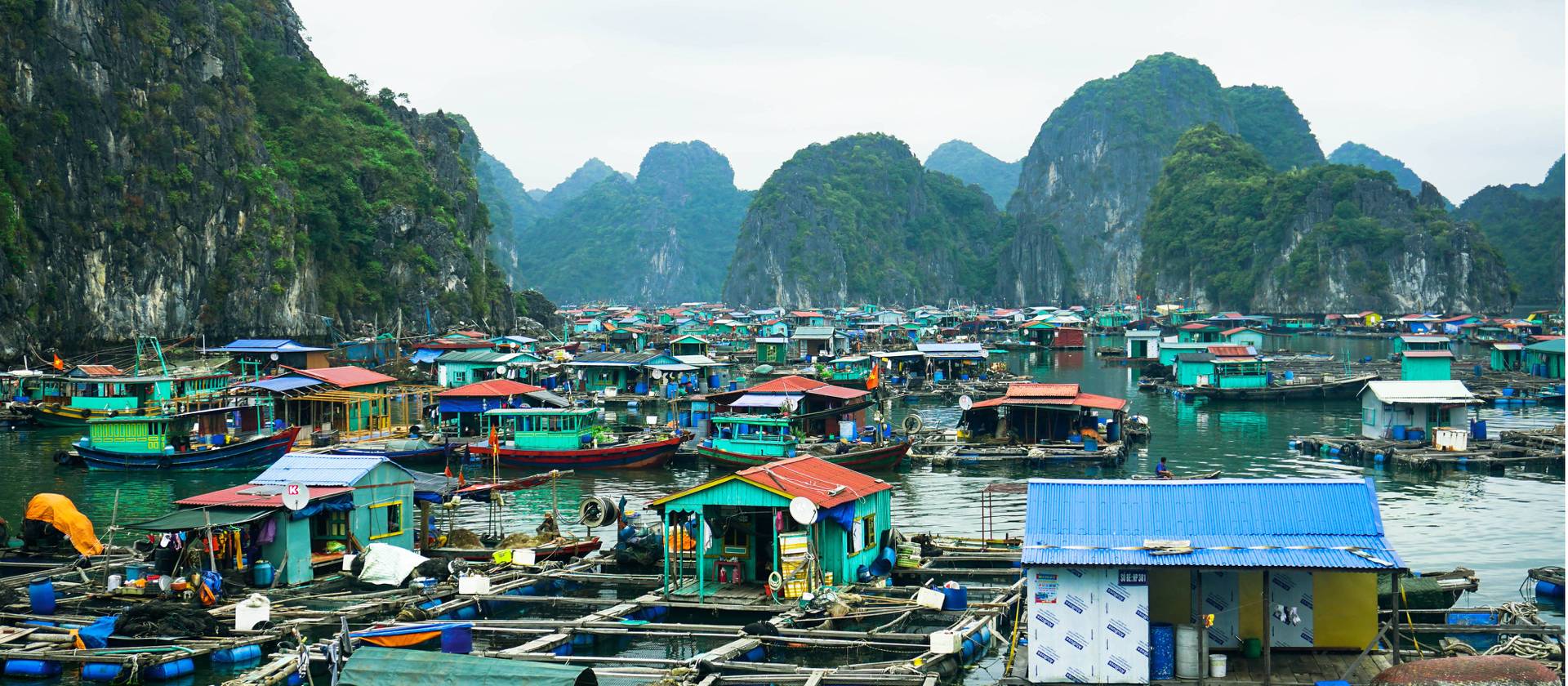 Kayak through floating fishing villages in Lan Ha Bay
