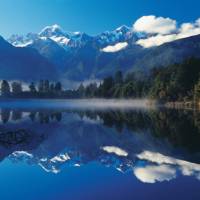 New Zealand’s tallest peaks – Mount Cook and Mount Tasman reflect off Lake Matheson | Rob Suisted