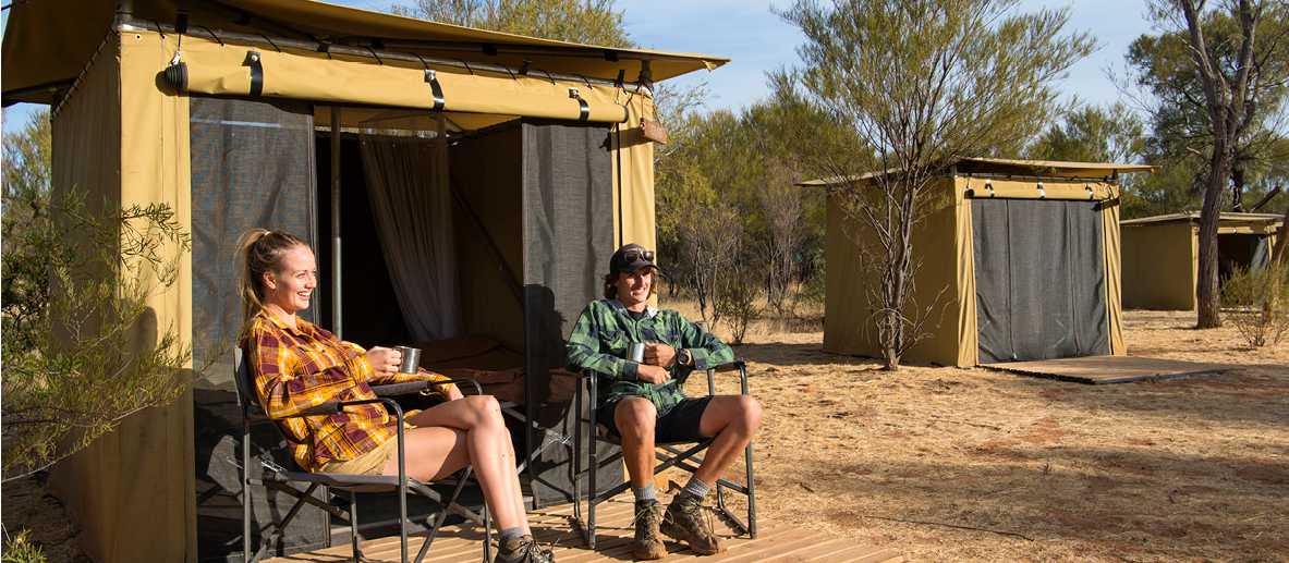 Trekkers relaxing on the porch of their campsites | Shaana McNaught