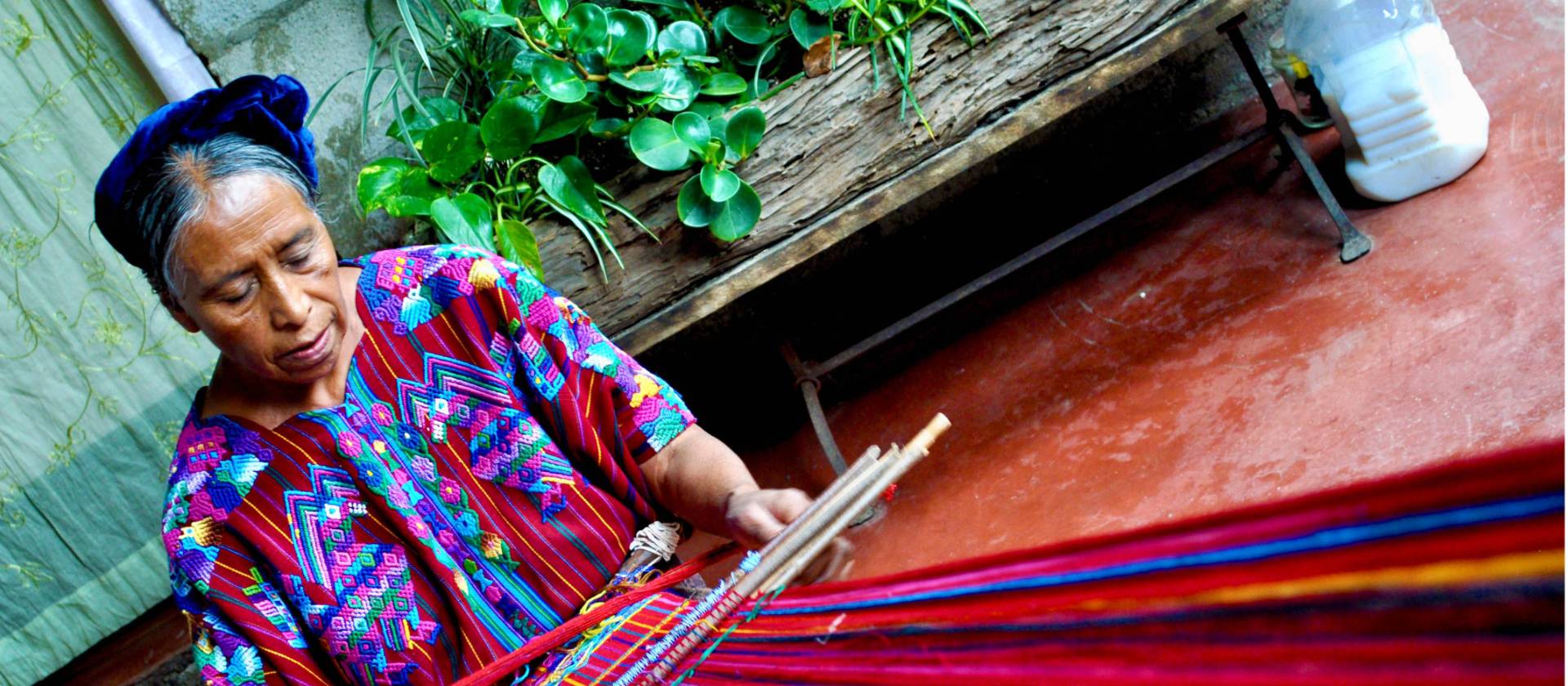 Learning the art of weaving under the guidance of a skilled local artisan
