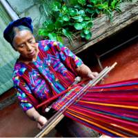 Learning the art of weaving under the guidance of a skilled local artisan