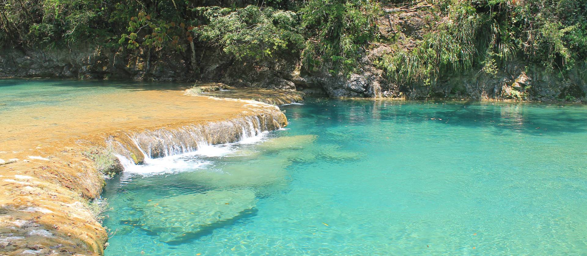 The relaxing crystal clear aquamarine waters of Semuc Champey National Park.