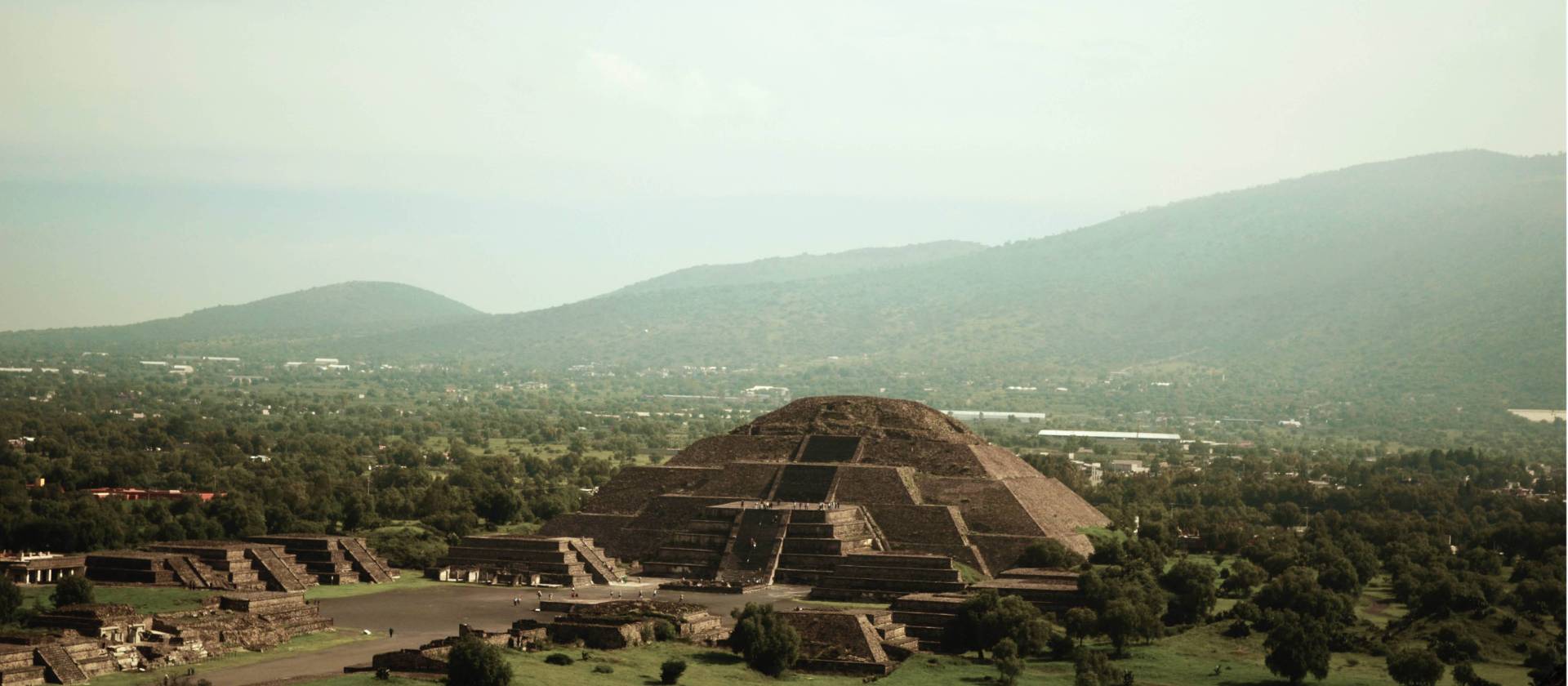 The Teotihuacan Pyramids site is known for its beautiful murals, extensive residential complexes, and the Avenue of the Dead,