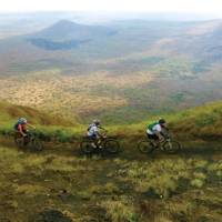 Cyclists riding on a scenic mountain trail