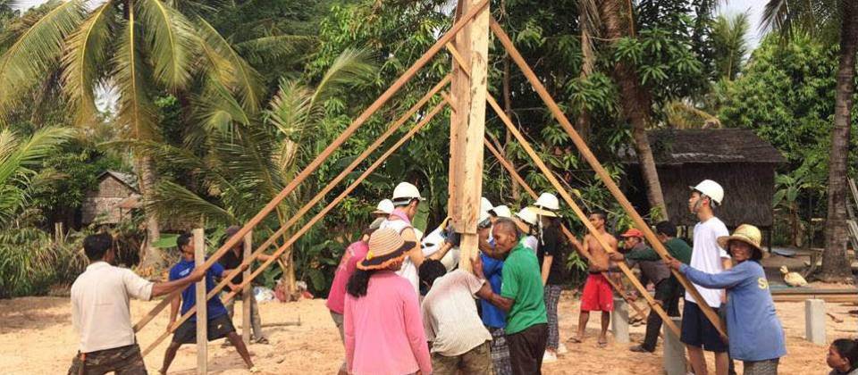 Student's assisting with building a house for a local family in need