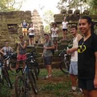 Students cycling around Angkor Wat | John Nichol