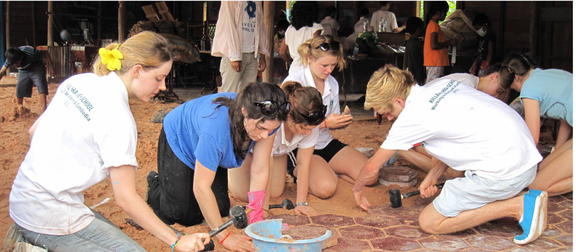 Students lending a hand during a school renovation project in Cambodia