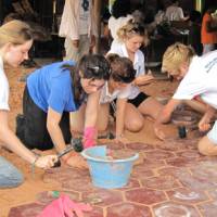 Students lending a hand during a school renovation project in Cambodia
