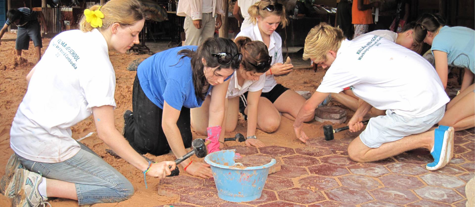 Students lending a hand during a school renovation project in Cambodia