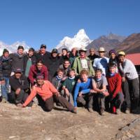 School group in Nepal, Ama Dablam towers behind them | Greg Pike