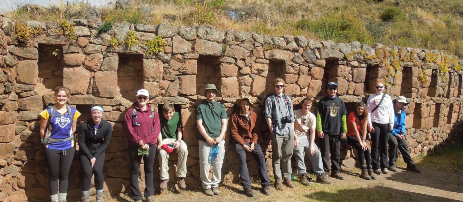 Students taking a break to explore the ruins along the Inca Trail | Eva Moon