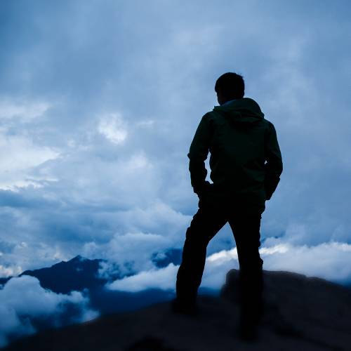 Student amongst clouds in Peruvian Andes