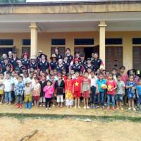 Students and local children in remote school in Vietnam