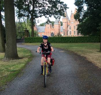 Young cyclist outside a castle near Ghent&#160;-&#160;<i>Photo:&#160;Hilary Delbridge</i>