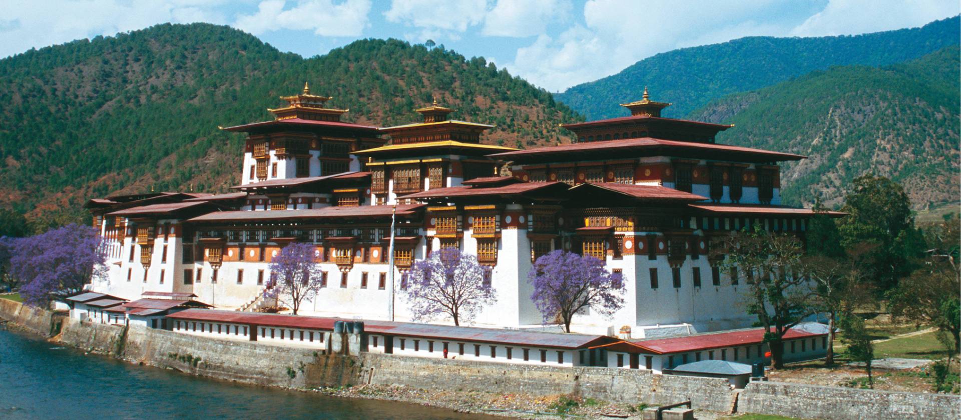 The Punakha Dzong in Western Bhutan is the winter residence of the Central Monk body and a highlight on our Himalayan Kingdoms Explorer. | Julie Anderson