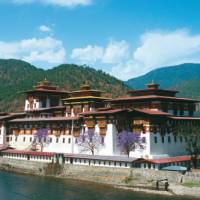 The Punakha Dzong in Western Bhutan is the winter residence of the Central Monk body and a highlight on our Himalayan Kingdoms Explorer. | Julie Anderson