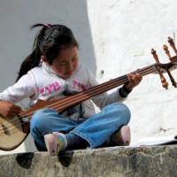 Cute local girl playing a traditional Indian instrument | Fiona Windon