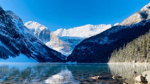 Admiring the crystal clear water of Lake Louise | Caroline Mongrain