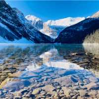 Admiring the crystal clear water of Lake Louise | Caroline Mongrain