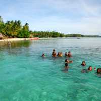 Children enjoying a swim in the waters of Melanesia | A Russ