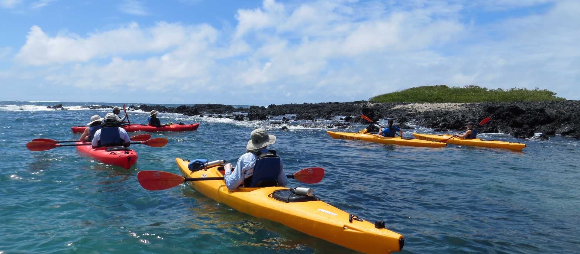 Sea kayaking through the pristine waters of Divine Bay in Galapagos.