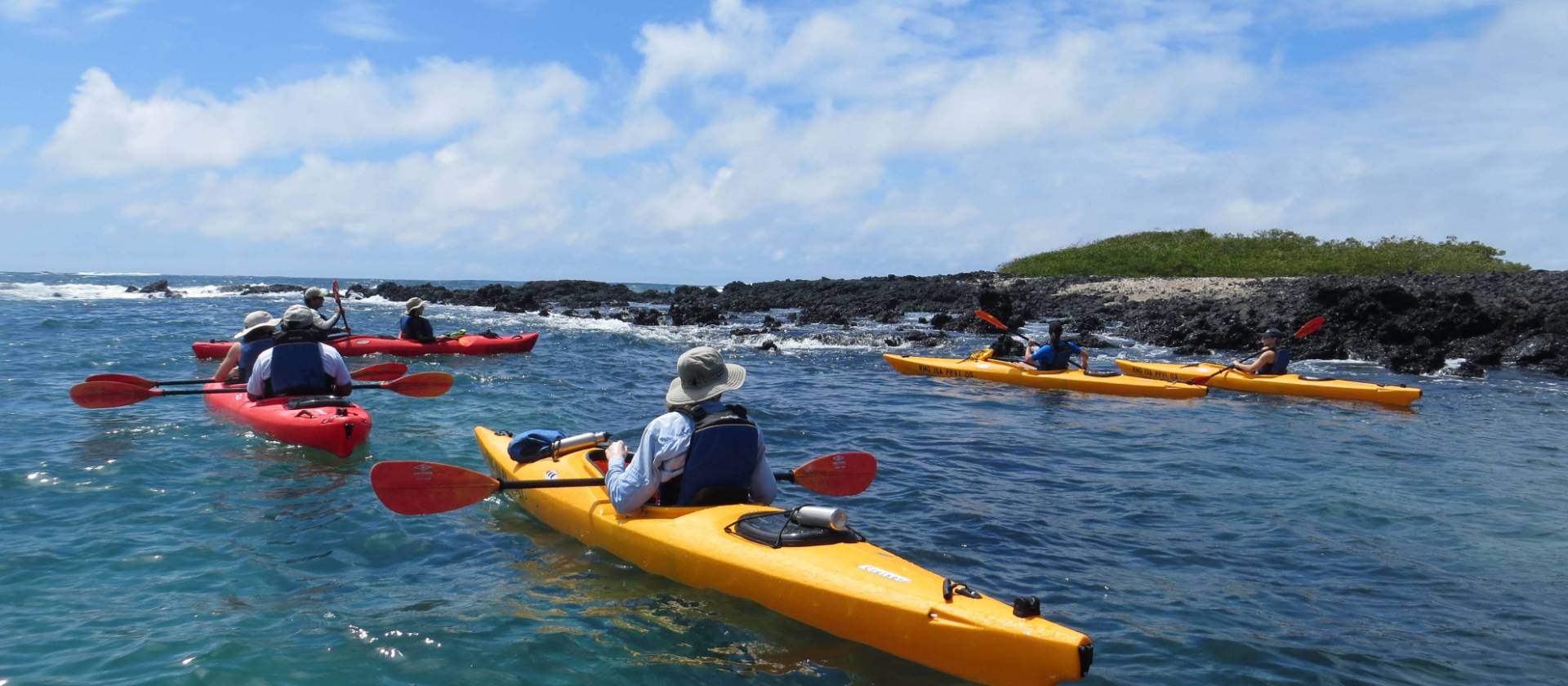 Sea kayaking through the pristine waters of Divine Bay in Galapagos.