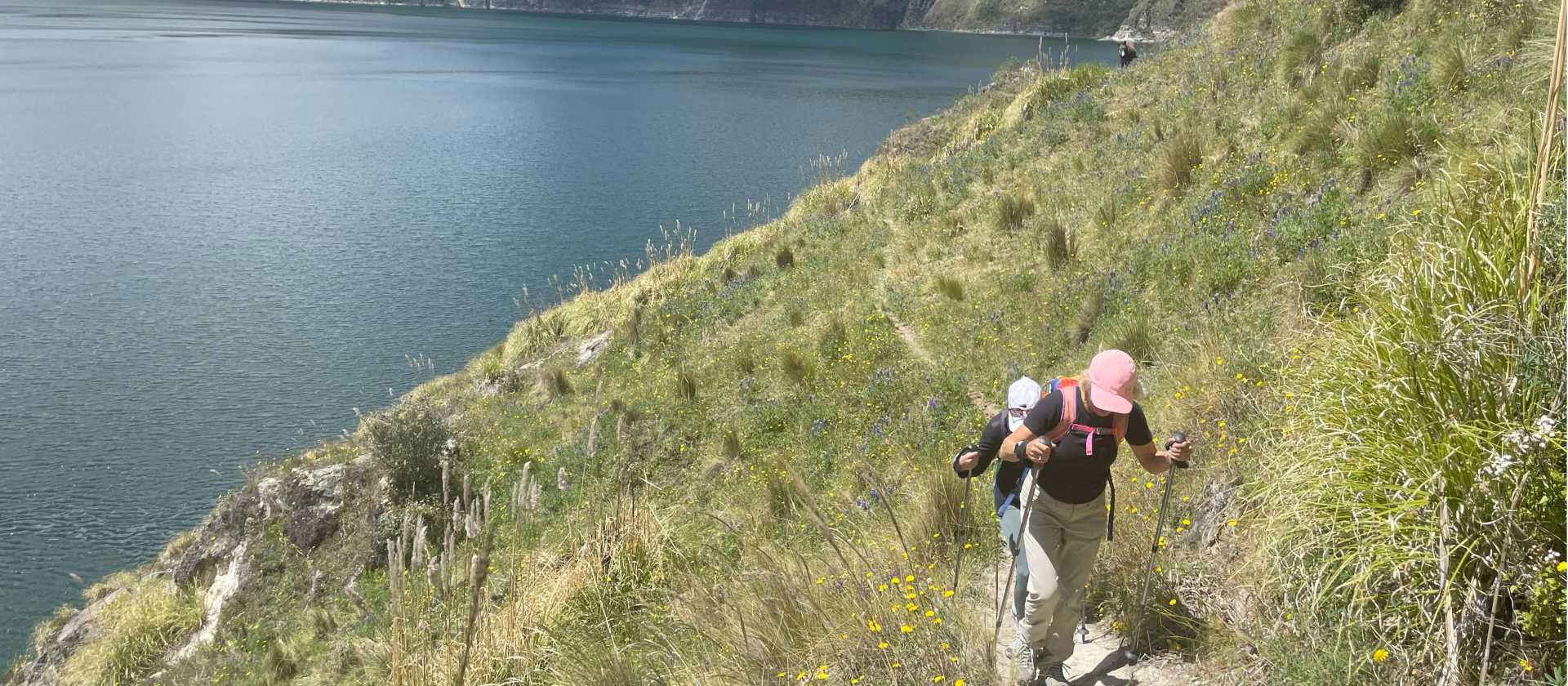 Hiking the narrow pathways beside the turquoise waters of the Quilotoa Crater.