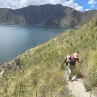 Hiking the narrow pathways beside the turquoise waters of the Quilotoa Crater.