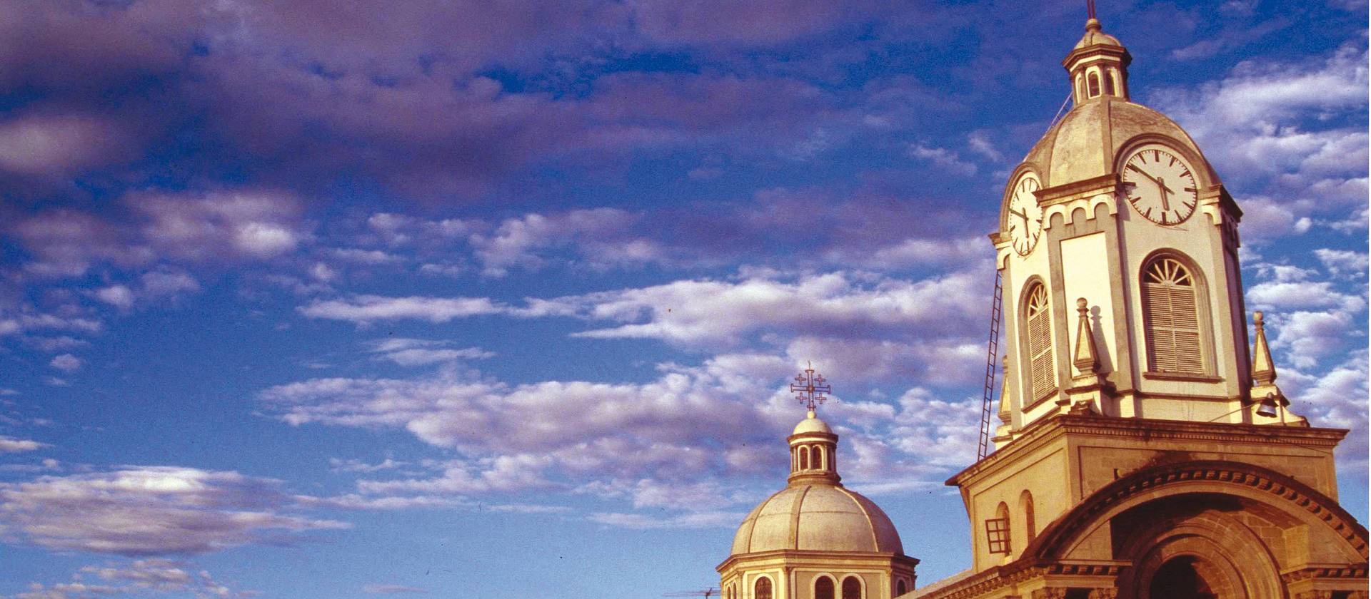 A church at sunset along the Avenue of the Volcanoes