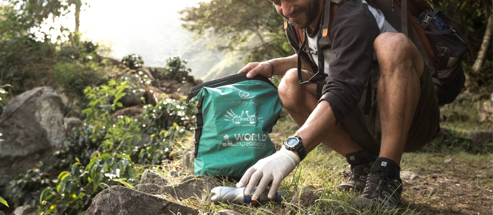 Traveller collecting litter along wilderness trails, part of our 10 Pieces litter collection program | Mark Tipple
