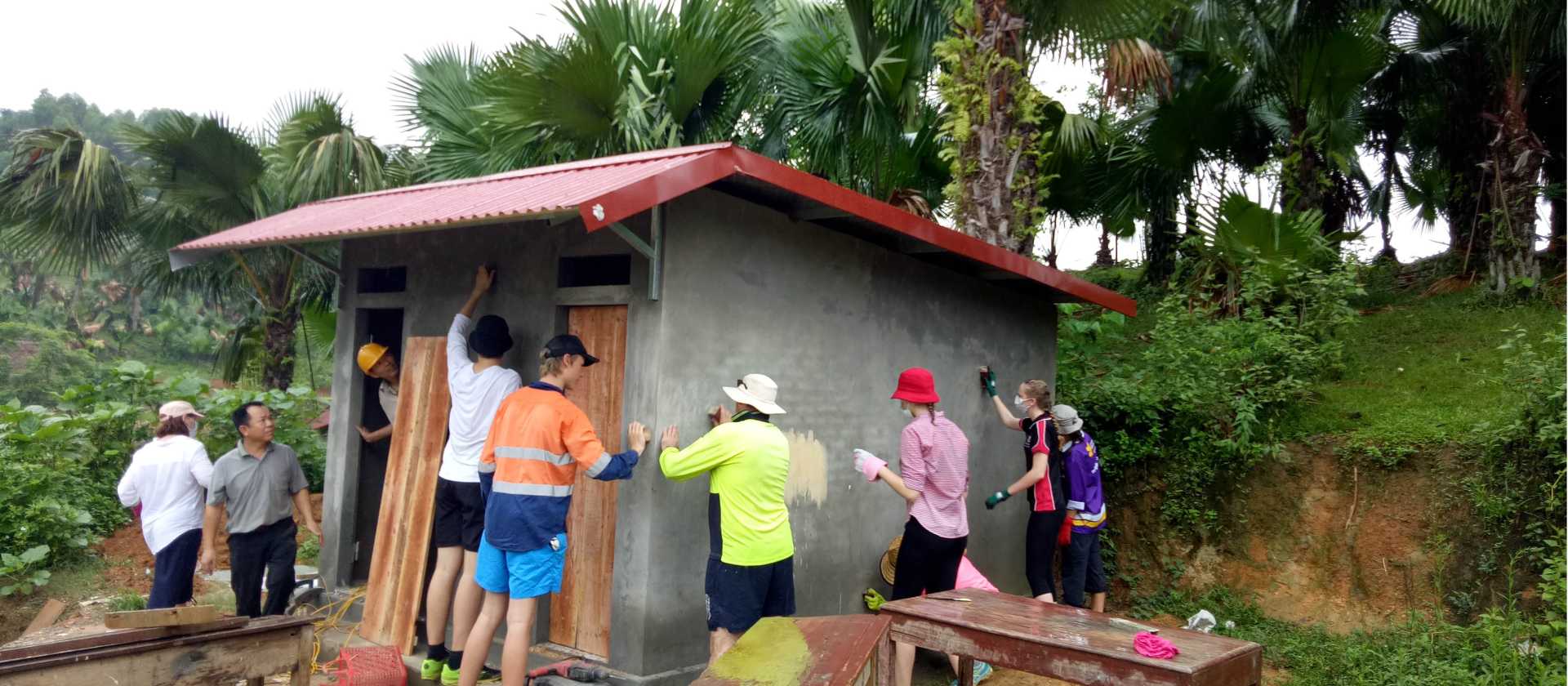 Students constructing new toilets for a remote school in Vietnam