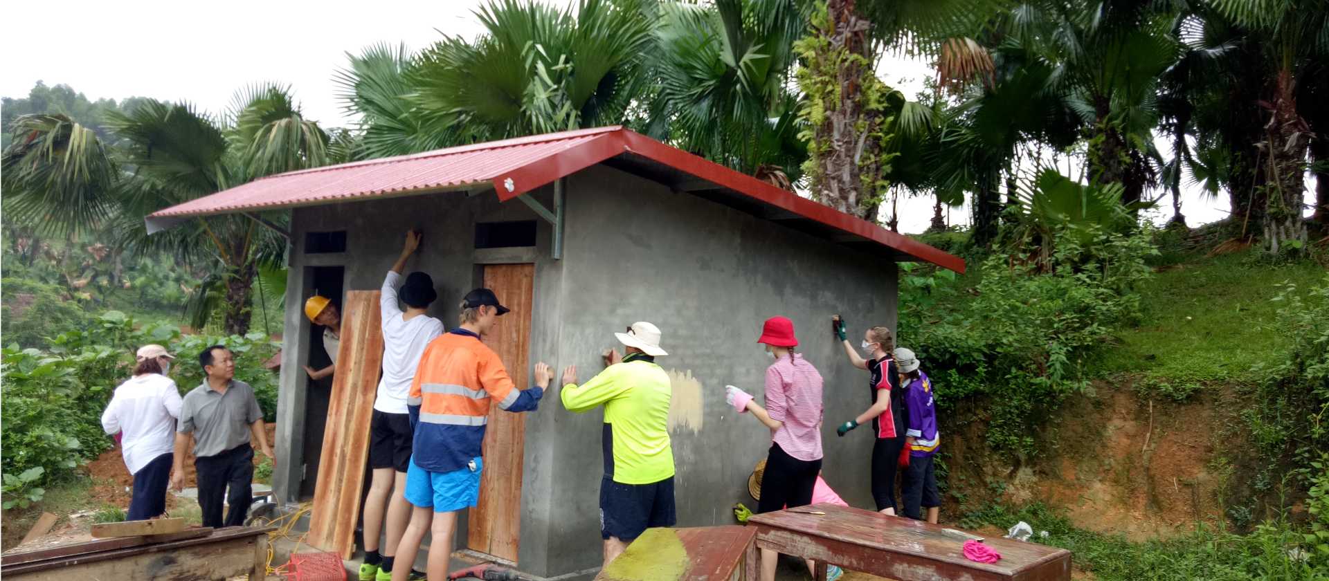 Students constructing new toilets for a remote school in Vietnam