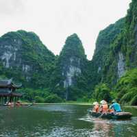 Drift through the jade-green waterways of the Trang An Grottoes aboard a traditional sampan | Jacob Pretorius