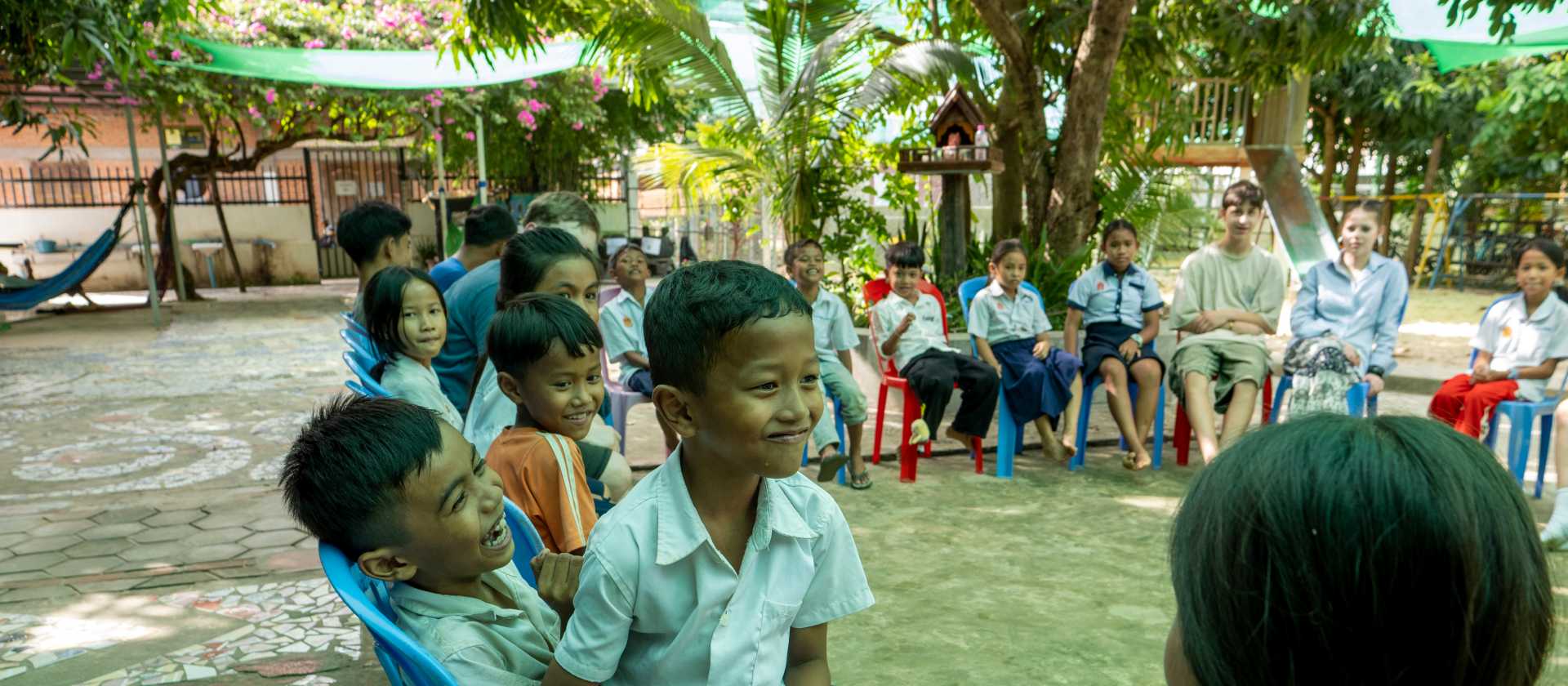 Students visiting a school whilst on a service learning program in Cambodia | Jordan Curzon