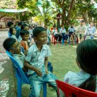 Students visiting a school whilst on a service learning program in Cambodia | Jordan Curzon