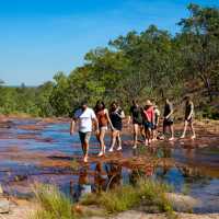 Students hiking in Kakadu National Park | Tourism NT/Shaana McNaught