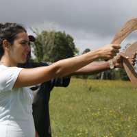 students learning how to throw boomerangs on Country