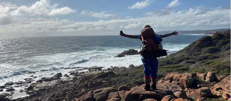 Student overlooking coast | Vera Williams