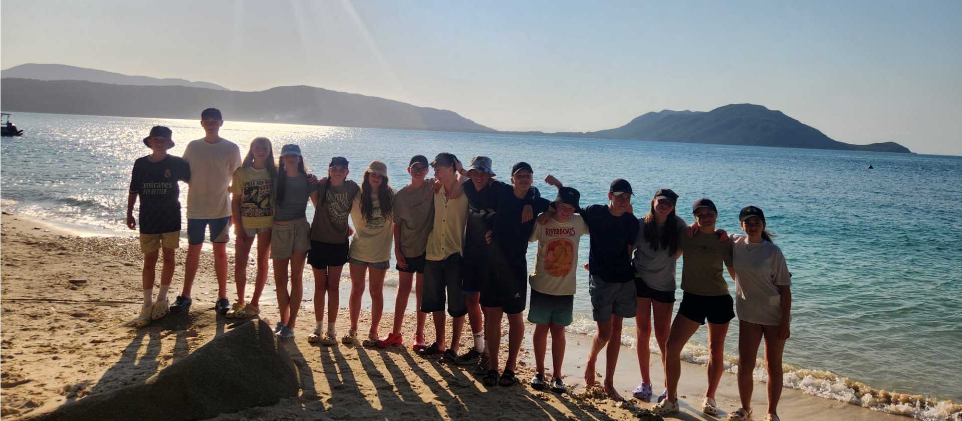 Students on the beach teamwork