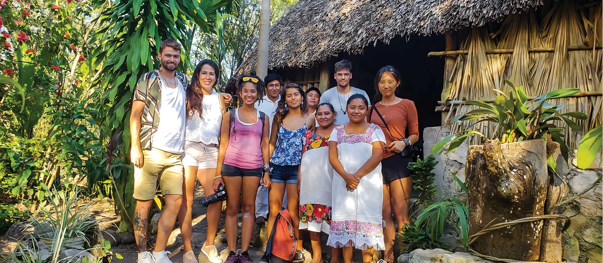 Happy faces come together after sharing time with the local community | EcoColours Tours