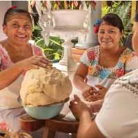 Ladies of the Mayan community preparing a large batch of tortillas. | EcoColours Tours