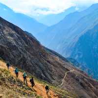 Hiking the Inca Trail with stunning views of the mountains all around