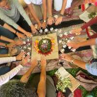 Participating in a traditional Andean ceremony, a sacred offering of gratitude to Pachamama (Mother Earth).