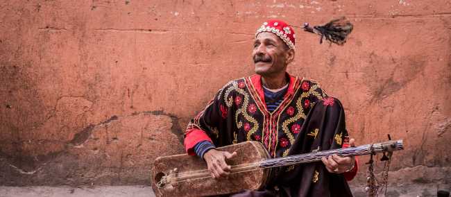 Musician plying his trade in the medina, Marrakesh | Richard I'Anson