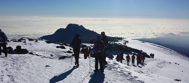 After a successful summit attempt, proud and elated we start our descent | Eva Moons